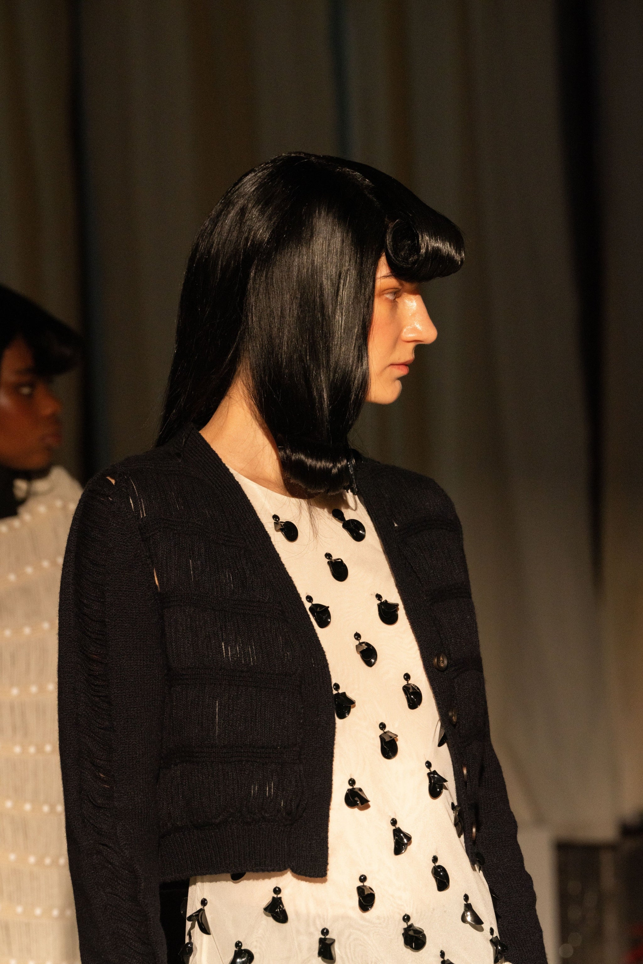 Model in black wig at Diotima Fashion Show